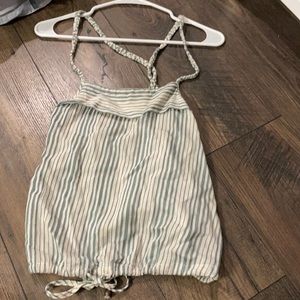 Crop top bunched and tied at the bottom.